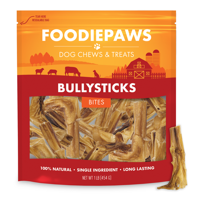 A resealable one pound Foodiepaws bag of bite-size bully stick pieces with a short dried chew piece standing alongside it